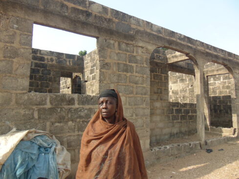 fati yahaya with her house in the background