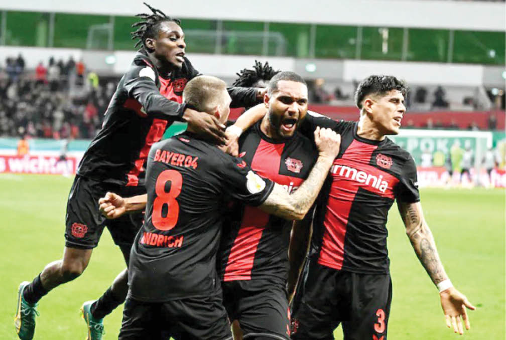 <p>Bayer Leverkusen players celebrating a Bundesliga win recently</p> 