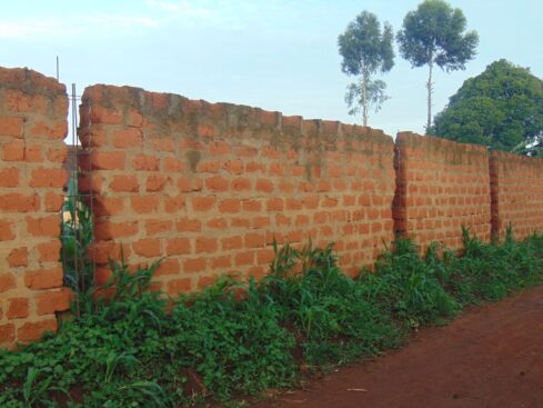 an old wall in kaka quarters made from red blocks