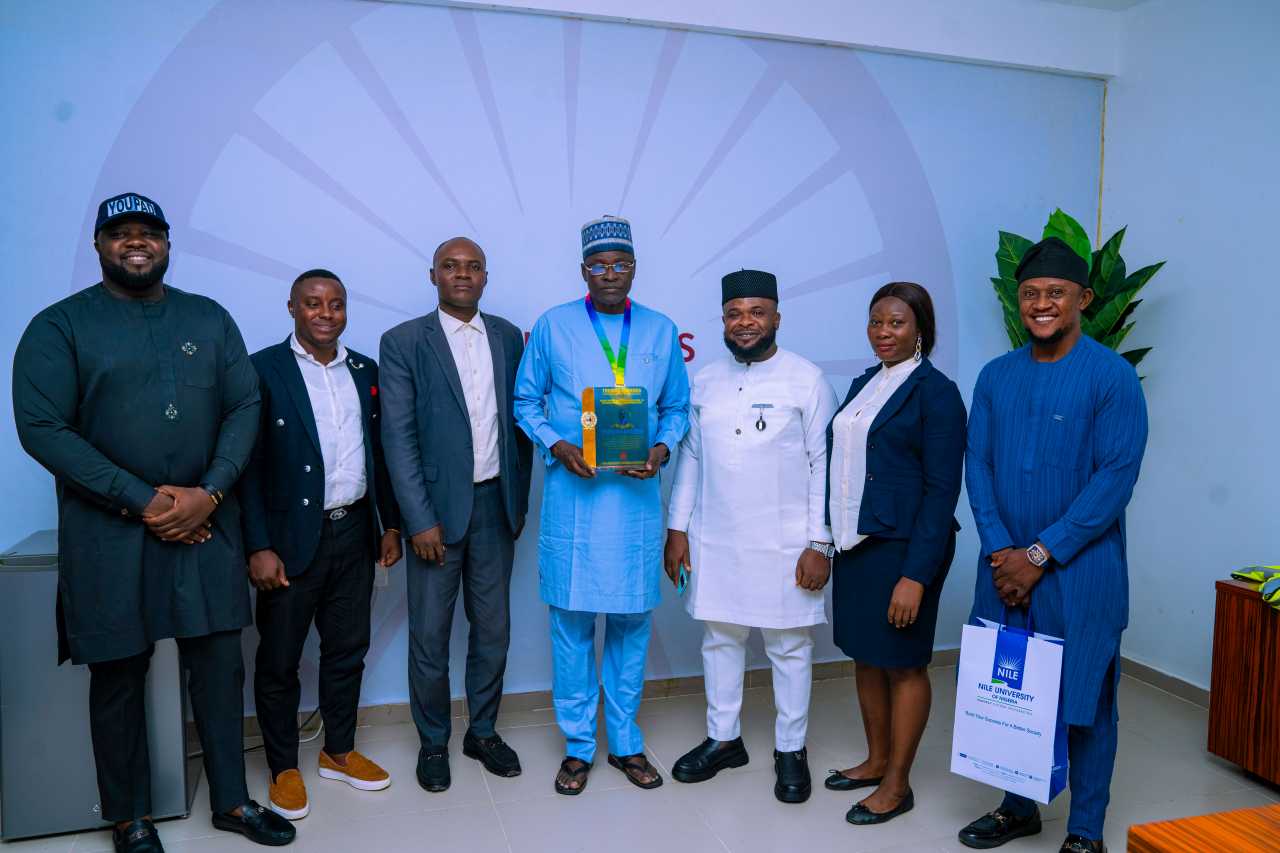 L-R: The leadership team of YOUPAD comprising Mr. Okewu Abel(Head of Nigeria Office), Mr. Kwabena Majoro (Head of South Africa Office), Mr. Austin Koussi (Vice- President, West Africa), Mr. Nwankwo Henry (President), Ms. Francine Etongo(Director, Gender Affairs), and Mr. Ochekwu Morgan (Nigeria Office) after presenting the Thomas Sankara Pan-African Leadership Prize for Excellence award to Nile University’s Vice Chancellor, Prof. Dilli Dogo (FNAMed).