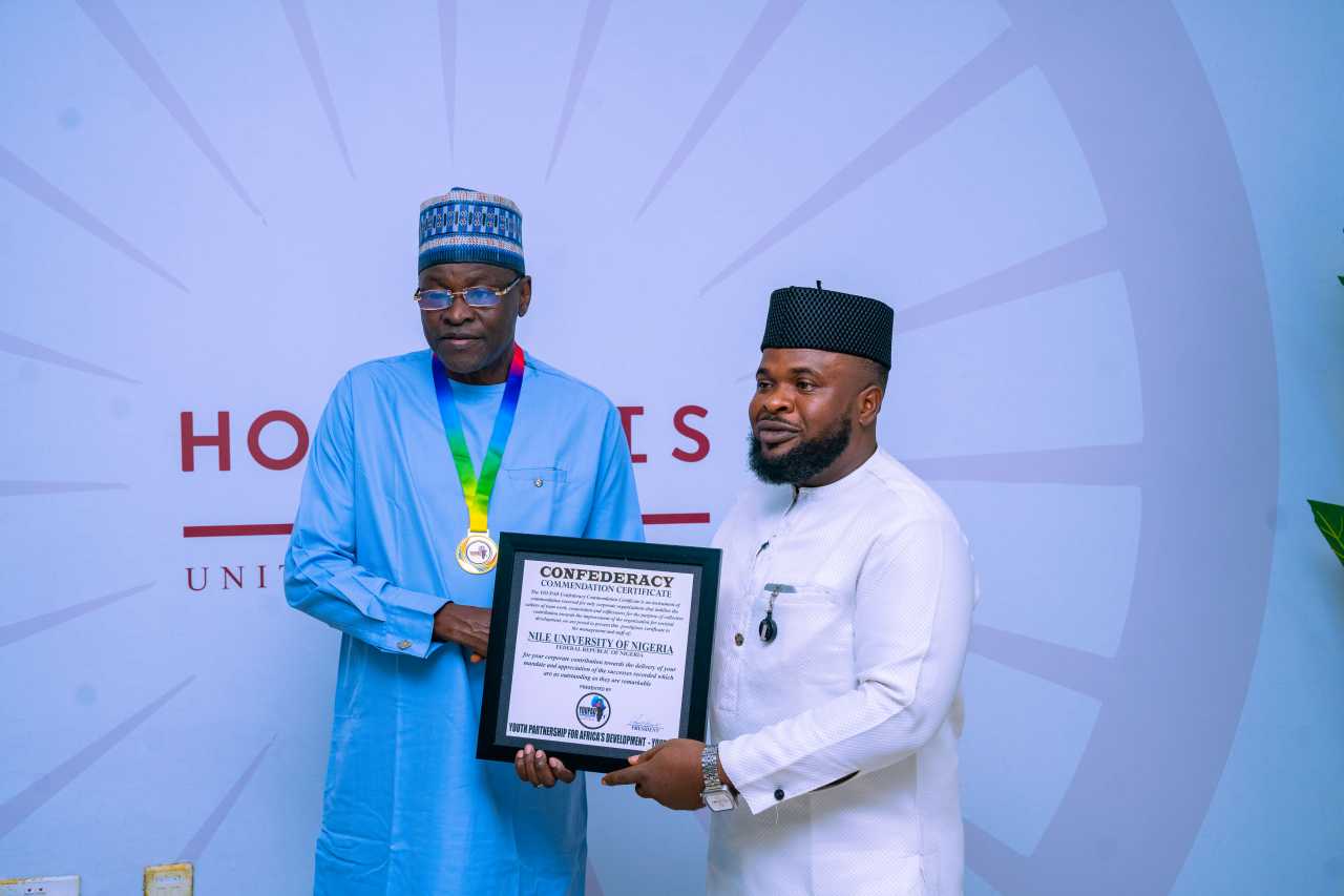 L-R: Nile University’s Vice Chancellor Prof. Dilli Dogo and Mr. Nwankwo Henry, YOUPAD President, during the presentation of the  Confederacy Commendation Certificate to Nile University of Nigeria