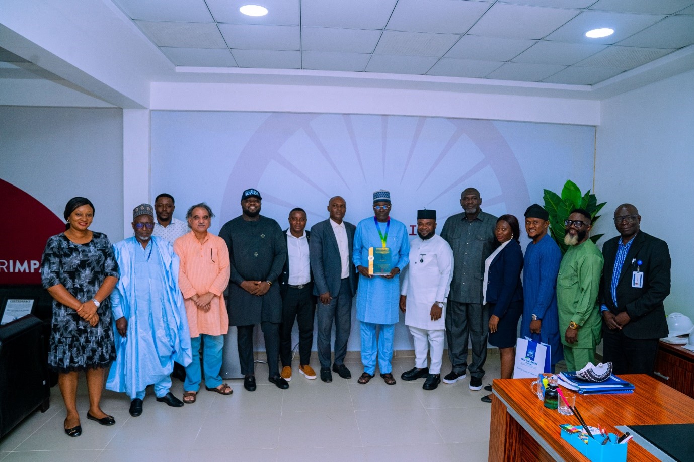 Group photograph of Prof. Dilli Dogo with the leadership team of YOUPAD and Management of Nile University Team.