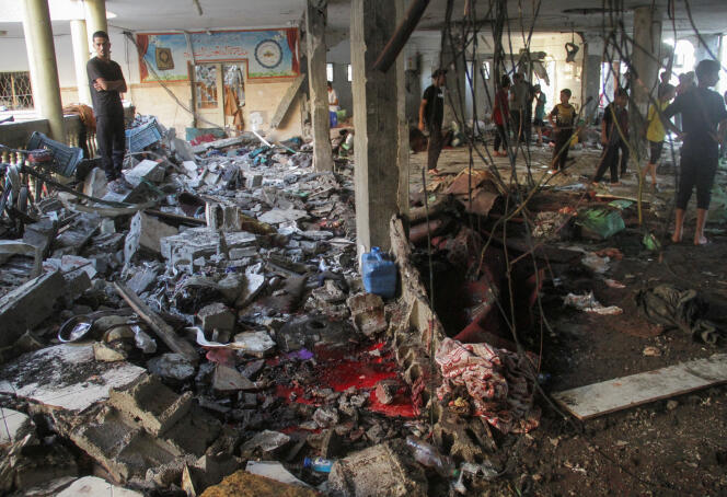 aftermath of an israeli strike on a school sheltering displaced people in gaza city