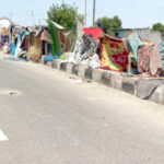 residents who could not access their homes pitch tents on the street at 505