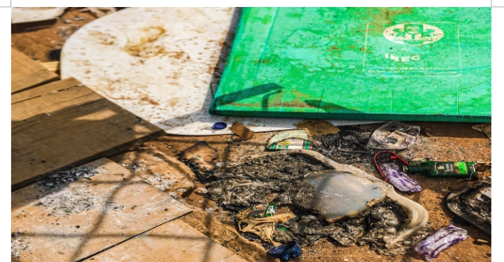 Damaged voting material after masked men armed with a riffle disrupted the voting process and burnt ballot papers and boxes in Adedeji Street, Mafoluku Oshodi during elections in Lagos.Photograph by Adeniran Ayodele/CCIJ