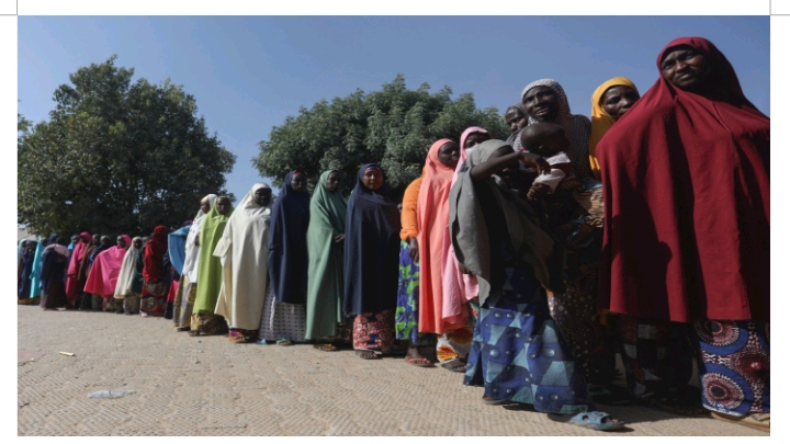 Nigerian women stand in line to cast their ballots at a polling station in Kano State. Photograph by Sodiq Adelakun/CCIJ