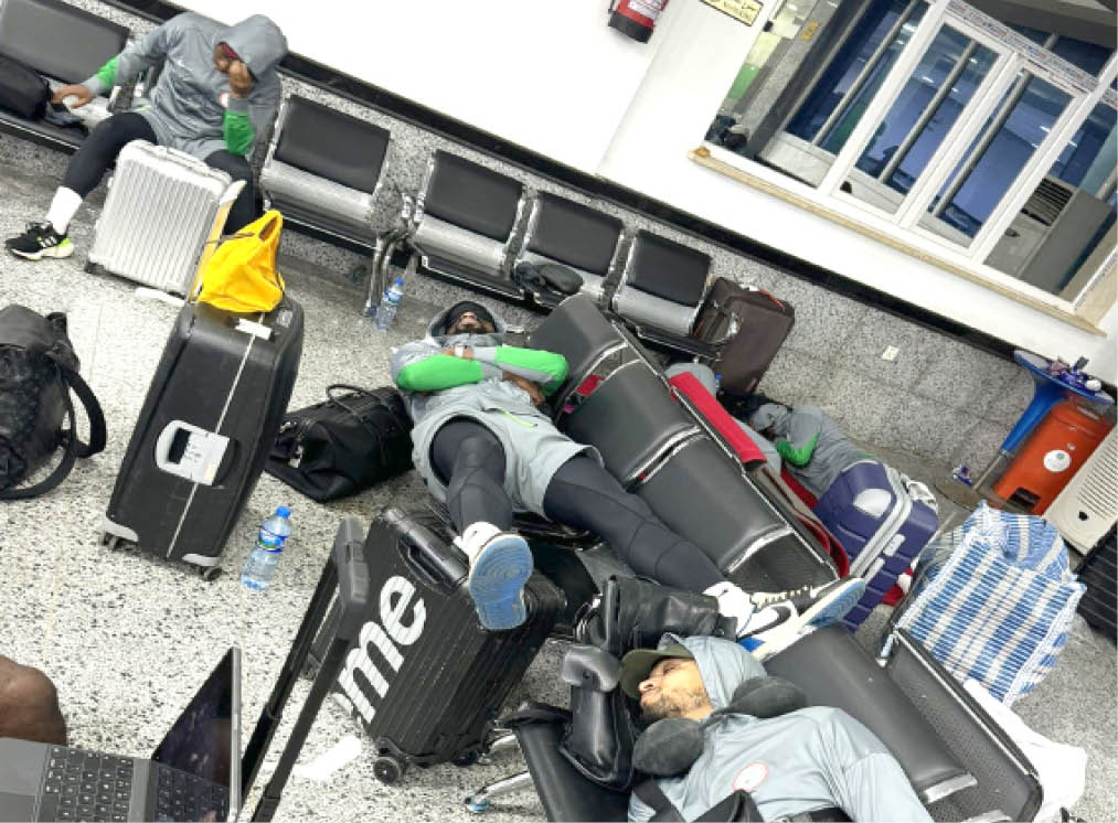 <p>a player of the super eagles sleeping on a chair at the al abraq international airport in libya on sunday night</p> 