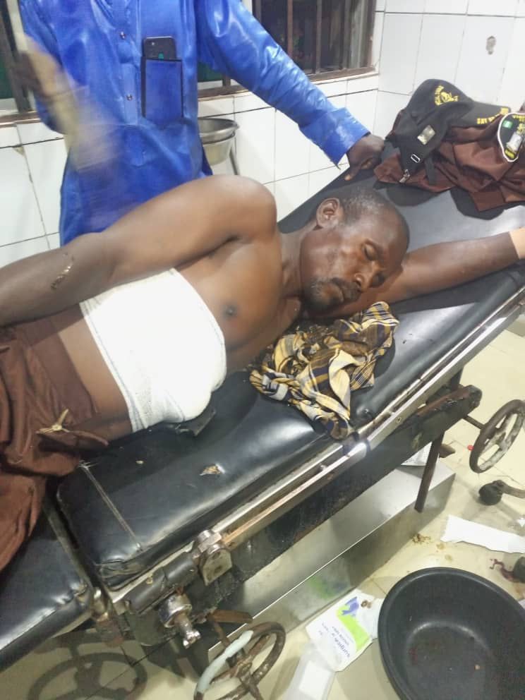 Abuja native doctor testing ‘bullet proof’ charm shots self in stomach