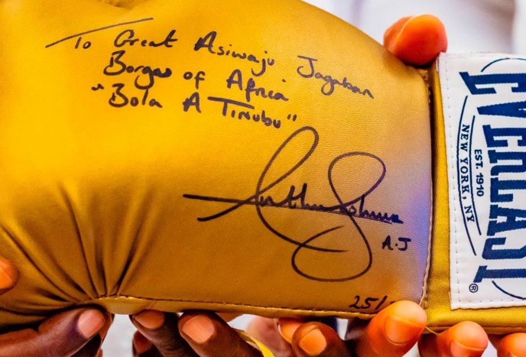 PHOTOS: Anthony Joshua Presents Autographed Glove To Tinubu